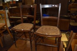 A pair of 19th Century stained frame cane seated bedroom chairs