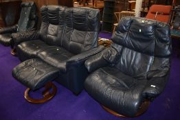 A Stressless suite comprising settee, two chairs and single footstool
