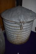 A large galvanised feed bin