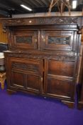 A period oak court cupboard, bears carved date 1697, further foliate and florette carving, width