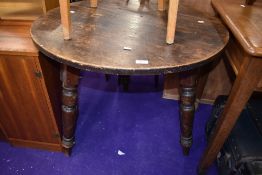 A 19th Century circular cricket style table having three turned legs, diameter approx. 81cm