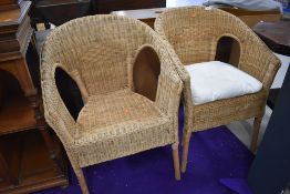 A pair of wicker tub chairs