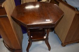 A late 19th/early 20th Century mahogany octagonal occasional table on part turned legs with