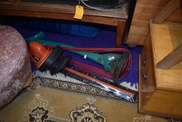 A Black and Decker electric hedge trimmer and a Bosch electric strimmer