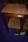 A stained frame plant stand of small proportions, having later formica to top and undershelf