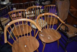 Five (three plus two) Ercol light stain beech spindle back kitchen chairs