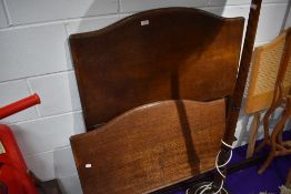 An early 20th Century oak single bed frame