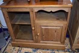 A natural pine entertainment or similar cabinet