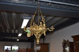 An Antique cast brass candle chandelier