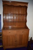 A vintage teak dresser of traditional form , shipped in by the owner from the Far East in the 1970s,