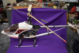 A Kalt 30 Baron radio controlled helicopter having a Futaba FP-S148 engine, no control unit
