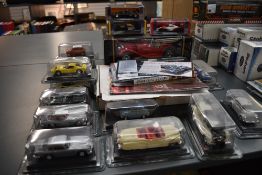 A Burago 1:18 scale diecast, Jaguar SS100 in window display box along with 13 1:43 scale diecasts