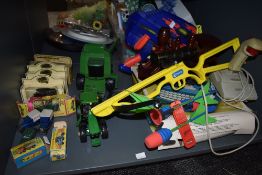 A shelf of mixed toys including two Matchbox Superfast diecasts no7 Refuse Truck and no48 Dodge