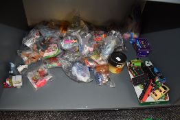 A shelf of modern toys and collectables including 1997 Mcdonalds toys, most in packets 1981 Ideal