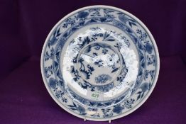 A porcelain plate hand decorated with floral garniture bearing Meissen crossed swords