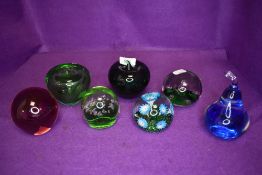 A selection of art glass paper weights in the form of fruit
