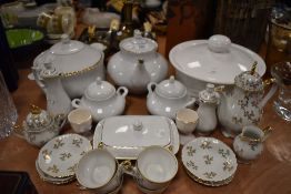 A selection of table ware ceramics including tureen tea pot and part coffee service