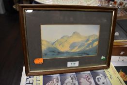 A framed print of Langdale pikes at sunrise.