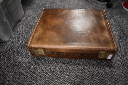 A leather bound briefcase having leather compartmented lining, Handle present but AF