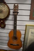 A vintage Encore by John Hornby Skewes student guitar, model ENC36N, soft case and couple of music