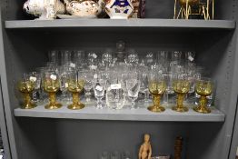A large assortment of vintage and retro glasses and a decanter, various styles and sizes including