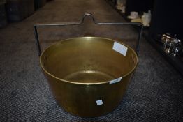 A brass jam pan.
