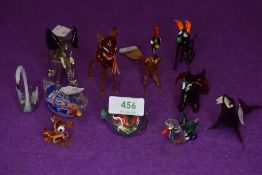 An assortment of small glass animals.