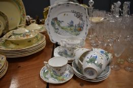 An assortment of Bell china having transfer pattern of cottage and foliage, accented with blue,red,
