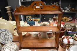 An antique mahogany wall shelf or what not