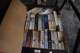 A box of novels, of war time romance interest and modern romance/comedy.
