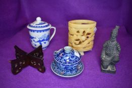 A mixed lot of oriental items including carved stone or mineral receptacle,figurine and lidded cup.