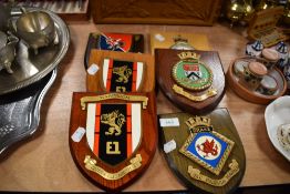 Six wooden heraldry shields including H.M.S Collingwood and Royal Air force station.