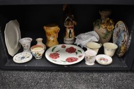 A collection of mixed ceramics including vases,plates and cups.