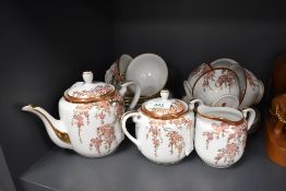 A mid century oriental part tea service having cherry blossom and gilt detailed pattern included are