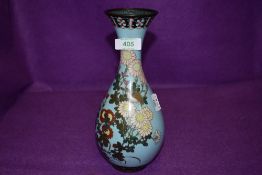 An antique cloisonne slender neck vase having sky blue ground decorated with birds and flowers