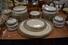 A part dinner service by Bisto having flower and swirl decoration with gilt detailing