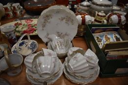 A collection of vintage cups and saucers, plates, bowl and jug having dainty floral pattern and