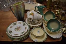 A selection of Art Deco styled ceramics including Susie Cooper soup cups and Sylvac vase
