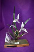 A delicate glass display piece depiciting swans and birds.