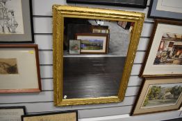 A large gilt framed mirror.
