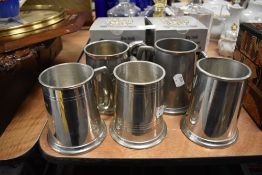 A selection of pewter and similar metal mugs including two boxed Nobleman mugs