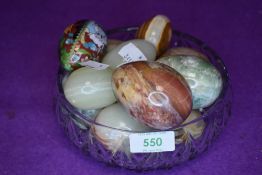 A selection of natural stone cut eggs and similar cloisonne egg