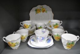 A Shelley trio having blue and lilac dog violet pattern with green foliage and silver gilt detailing