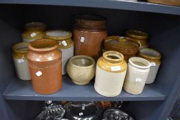 A selection of earthen ware jars and similar, various sizes and styles, some with lids.