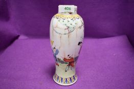 An antique Chinese export porcelain vase decorated with scene of family game or dance