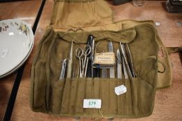 A selection of surgeons and doctors medical field instruments including scalpel razor etc