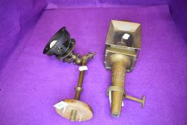 An antique brass coach lamp and a wall mounted light fitting,possibly originally a gas light which