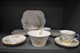A collection of Shelley cups and saucers, cake plates, sugar bowl and side plates having bluebell,