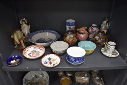 A mixed collection of oriental and oriental styled ceramics including figurines,ginger jars bowls