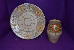 A large Bursley ware charger having trellis pattern, signed Charlotte Rhead and numbered TL3 to